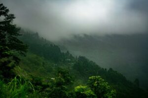 A mountain landscape with lush green hills.