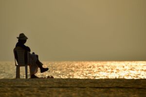 Person Sitting on the beach